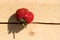 Juicy strawberry on a rough fresh board with a crack. Rustic style. Close-up, copy space