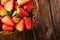 Juicy strawberry on wood background