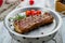 juicy Striploin Steak on white wooden table