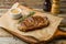 juicy Striploin Steak on wooden board on old table