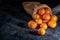 Juicy tangerines on dark background