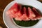 Juicy yummy Organic watermelon sliced in a decorative serving during the touristic relaxation in the morning breakfast