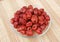 Jujube, Chinese dried red date fruit on a plate against wood background