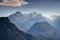 Julian Alps deep valleys in autumn haze with snowy Triglav peak