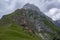 Julian Alps mountain Mangart from Mangrt saddle, Slovenia\\\'s Highest Panoramic Road, foggy weather