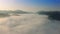 Julian Alps, Slovenia - 4K flying above the clouds over Julian Alps at sunrise at the beautiful Soca Valley in Triglav