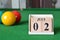 July 02, number cube with balls on snooker table, sport background.