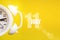 July 11st . Day 11 of month, Calendar date. White alarm clock on yellow background with calendar day. Summer month, day of the