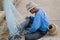 July 12 2017 - Chantaburi ,Thailand - Old Fishermen clearing fisherman net , a lot of small fish