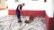 July 13, 2020. Granada. Spain: Worker cleans the drains hatch and removes dirt and debris from the sewer. Plumber cleans