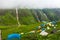 July 14th 2022, Himachal Pradesh India. Multiple colorful tents at Bheem Dwari base camp with beautiful mountains peaks and