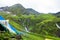 July 14th 2022, Himachal Pradesh India. Multiple colorful tents at Bheem Dwari base camp with beautiful mountains peaks and