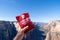 JULY 17 2018 - SPRINGDALE UTAH: Hiker holds up a package of cinnamon bears candy after finishing a hike