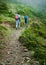 July 18th Uttarakhand INDIA. Hikers with backpacks walking on a trail in the lower Himalayan region