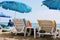 July, 2017 - People rest on deckchairs in the shade of beach umbrellas on Cleopatra Beach Alanya, Turkey