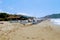 July, 2017 - People rest on deckchairs in the shade of beach umbrellas on Cleopatra Beach Alanya, Turkey