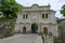 July 2021 Parma, Italy: Entrance-fortress of Cittadella park and its visitors on sunny day