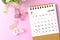 A July 2023 desk calendar for the organizer to plan and reminder and paer butterfly on pink colour background