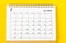 The July 2023 Monthly desk calendar for 2023 year on yellow background