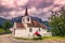 July 23, 2015: Traveller at the Stave church of Undredal, Norway