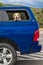 JULY 24, 2018 MONTROSE COLORADO USA - Golden Lab looks out of back window of blue car, Black Canyon, Colorado