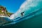 July 7, 2018. Bali, Indonesia. Surfer ride on big barrel wave at Padang Padang. Professional surfing in ocean