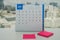 July calendar with pink mock up postit for leaving message to remind meeting and appointment