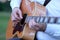 Jumbo guitar in the hands of a musician