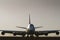 Jumbo jet in silhouette on airport runway