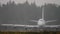 Jumbo jet taxiing in heavy rain