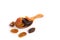 Jumbo raisins in wooden spoon on white