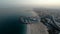 Jumeirah Beach near Burj Al Arab hotel in Dubai, UAE. Helicopter view