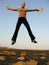 Jump girl with autumn leaves