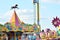 Jump ride carousel at spring festival in Warsaw, fairground with many attractions and amusement park. Warsaw Stegny