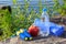 Jump rope, apple, towel and bottle with water on rock with sea s