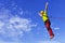 Jump rope from a high rock in the mountains.