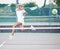 Jump, tennis sports and woman on court outdoors for match, game or competition. Training, jumping serve or female