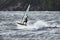 Jumping anonymous windsurfer in Baltic Sea stormy waters