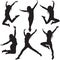 Jumping female silhouettes