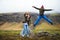 Jumping Man and Woman in Iceland Valley