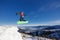 Jumping snowboarder in mountains in ski resort on blue sky background Dragobrat