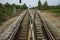 Junction of railway track with green tree at left and right side of railway.filtered image.choose for life concept.choice of life