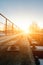 Junction of railways track in trains station against beautiful light of sun set sky use for land transport and logistic industry