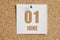 june 01. 01th day of the month, calendar date.White calendar sheet attached to brown cork board.Summer month, day of the