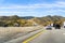 June 10, 2018 Los Angeles / CA / USA - Driving on the interstate through mountains covered in green shrubs and dry grass