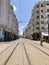 June 14, 2019 Casablanca Morocco. The Moroccan lady walk across the track, while the Tram is approaching.