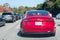June 14, 2019 Los Altos Hills / CA / USA - Model 3 Tesla slowly advancing on the I-280 freeway towards San Jose on a busy day,