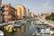 June 15, 2017 Sunny day in Chioggia, touristic season, church, port for small boats and canal, reflections