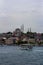 June 19, 2019 - Istanbul, Turkey - View of RÃ¼stem PaÅŸa Camii mosque from the opposite bank on the Golden Horn, ferry boats are