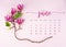 The June 2023 calendar page with pink magnolia flower on pink background